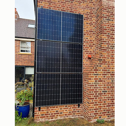 wall mount solar racking system with solar panels on residential house exterior wall